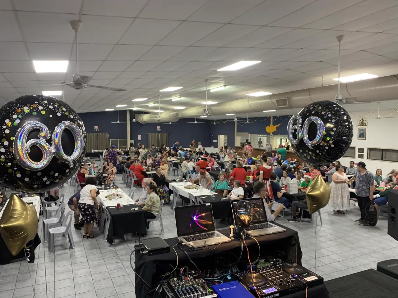 60th birthday party with balloons and a full dance floor