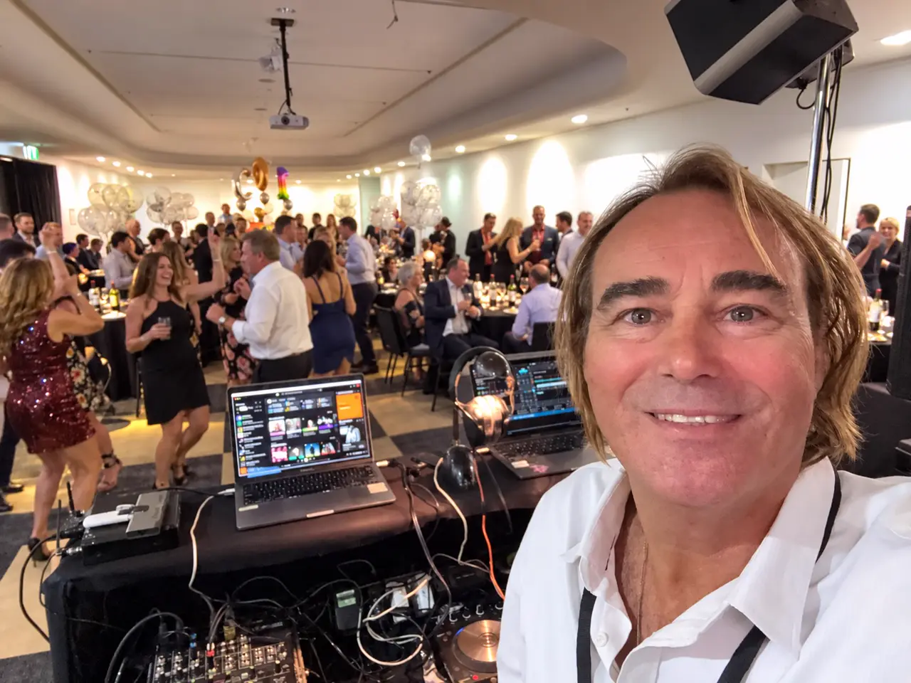 Colin Carthew behind the decks with a full dance floor behind him