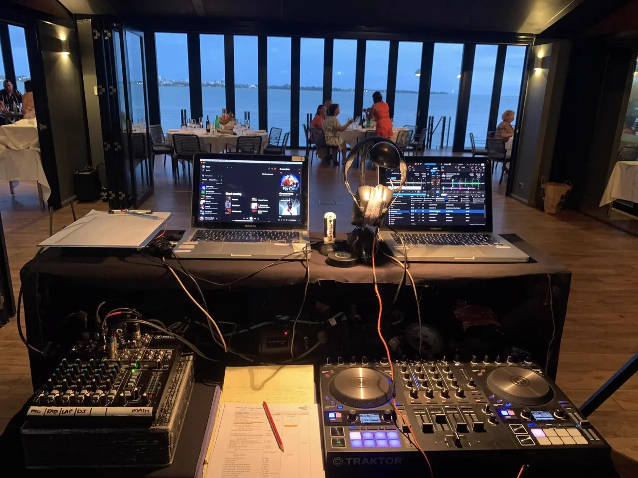 DJ controller, mixer and laptops at an event